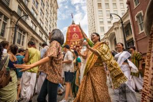 Festival Participants dance and sing in the streets