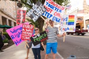 "Forward Together Not One Step Back" and "We Reject you" signs, Trump Campaign Rally Protest