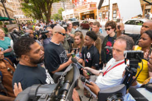 Reporters interview protesters