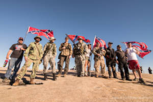 A group of armed militia members stand on top of Stone Mountain