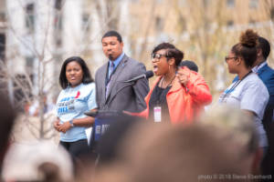 Marypat C. Hector address a crowd at a protest