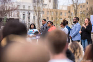 Marypat C. Hector address a crowd at a protest