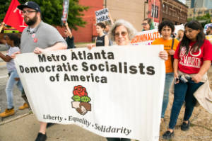 Protesters with sign, "Metro Atlanta Democratic Socialists of America"