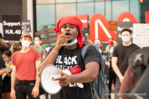 A protester speaks into a megaphone