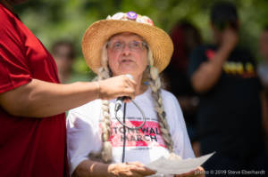 Protester speaks on microphone