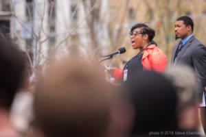 Marypat C. Hector address a crowd at a protest