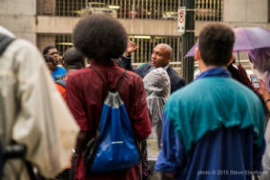 Mawuli Davis speaks to a group of protesters