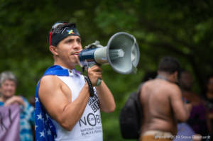 Protester speaks on megaphone