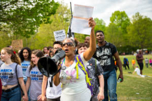A protester addresses the crowd using a megaphone