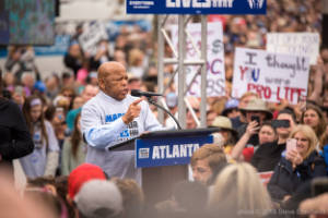 Congressman John Lewis addresses the crowd at the protest