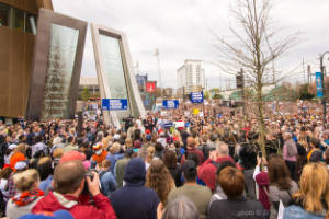 Thousands of protesters stand outside of the Center for Civil and Human RIghts