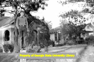 David Lennox Jr. standing on a street corner, Atlanta, Georgia, circa late 1930s or early 1940s
