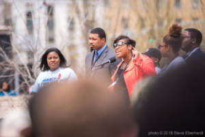 Marypat C. Hector address a crowd at a protest