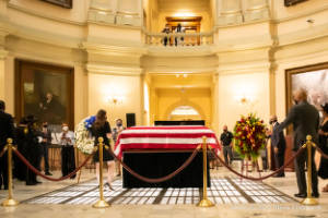 A flag-draped casket sits in the Georgia State Capitol rotunda