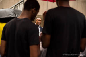 Mawuli Davis speaks to a group of protesters
