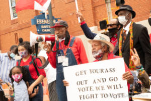A group of people stand outside of Ebenezer Baptist Church