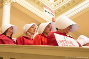 Protesters dressed as characters from Handmaiden's Tale