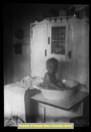 Infant having a bath, Atlanta, Georgia, circa late 1930s or early 1940s