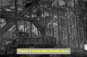 Steam shovel filling a dump truck, Atlanta, Georgia, circa late 1930s or early 1940s