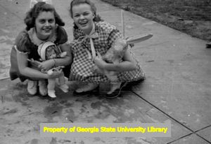 Girls playing with dolls and stuffed animals, Atlanta, Georgia, circa late 1930s or early 1940s
