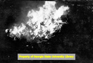 Used car lot ablaze, Guntersville, Alabama, circa late 1930s or early 1940s