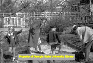 Inspecting the sandbox, Atlanta, Georgia, circa late 1930s or early 1940s