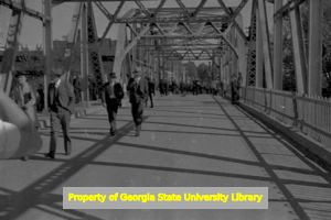 Pedestrians crossing a bridge, Georgia, circa late 1930s or early 1940s