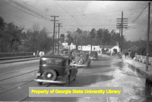 Cars crossing a bridge, circa late 1930s or early 1940s