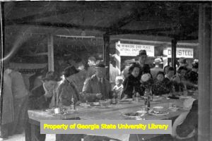 Family meal after an amateur baseball game, Atlanta, Georgia, circa late 1930s or early 1940s