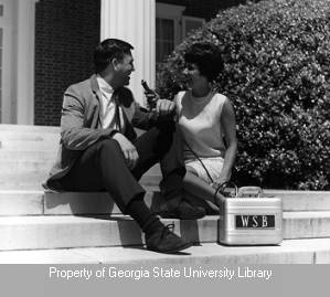 Sherrie Johnson interviewing man on steps
