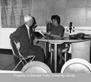 Sherrie Johnson interviewing man in studio