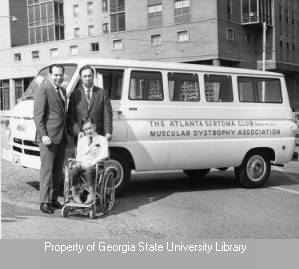 Don Kennedy with a Muscular Dystrophy Association van