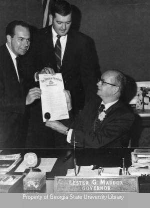 Governor Lester Maddox and Don Kennedy holding a proclamation