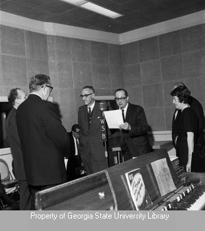 Elmo Ellis and Bob Van Camp in studio with group