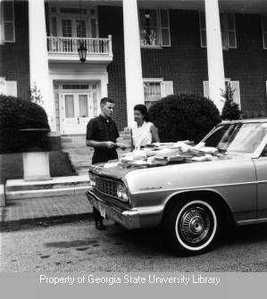 Paper on car at White Columns building