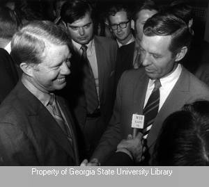 Jimmy Carter shaking hands with Carl Sanders