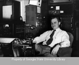 Man at typewriter in WSB control room