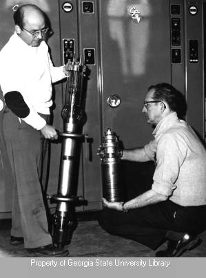 Ed Perry and Wilbur Fattig with radio transmitter components