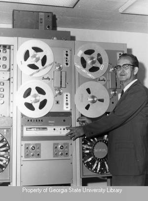 Man at rack-mount tape equipment