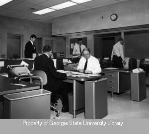 Men working in the WSB newsroom