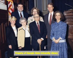 Cathey Steinberg, Lieutenant Governor Pierre Howard, and Mary Margaret Oliver posing with a group, state capitol, Atlanta, Georgia, March 7, 1991.