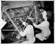 Lead mechanics working on QEC for Allison Prop Jet Engines, 1961