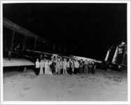 Passengers and flight crew standing beside an Eastern Air Transport Curtiss Condor, circa 1930s