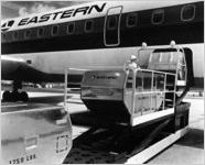 Baggage being loaded into Eastern Air Lines plane, circa 1980s