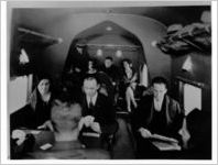Passengers in the cabin of an Eastern Air Transport Curtiss Condor, circa 1930s