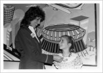 Eastern employee presenting award to girl at children's art dedication during an Eastern Air Lines promotional trip to Walt Disney World, 1983-05-11