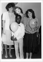 Children with clown at children's art dedication during an Eastern Air Lines promotional trip to Walt Disney World, 1983-05-11