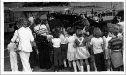 Eastern Air Lines employees and their families viewing Eastern Air Transport Pitcairn Mailwing during 50th anniversary celebration, 1978