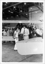 Eastern Air Lines employees viewing Eastern Air Transport Pitcairn Mailwing during 50th anniversary celebration, 1978