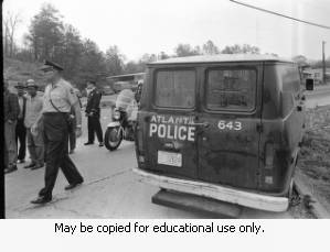 Atlanta police van, police, and protesters on Northside Drive, during the Atlanta sanitation workers strike, Atlanta, Georgia, April 13, 1970.